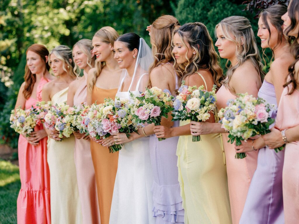 Colorful bridesmaid dresses and bouquets for summer New England wedding